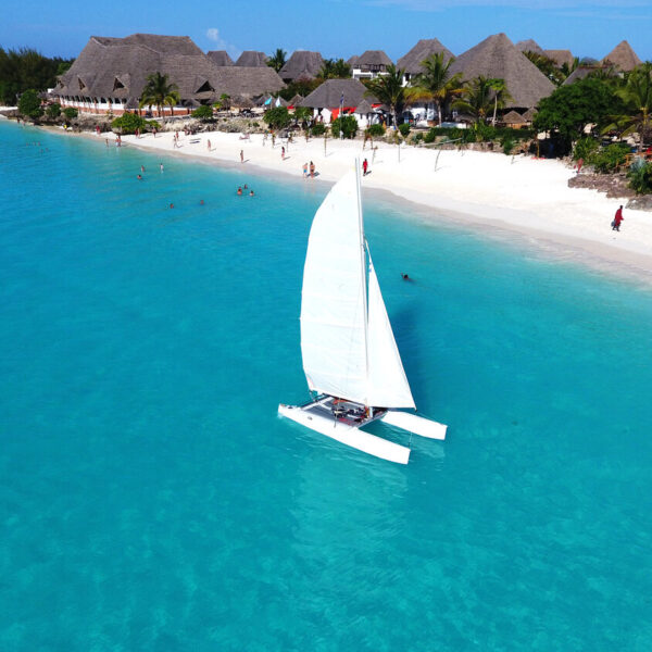 Aerial,View,Of,Sailboat,At,Sea,In,Zanzibar,Beach,,Tanzania.